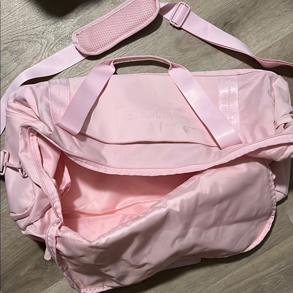 Gymshark Pink Travel Bag with Soft Fabric and Multiple Compartments